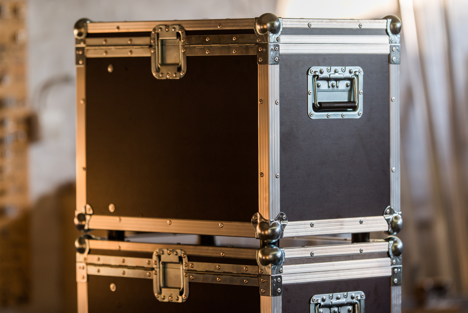 Two smaller-sized road cases are stacked one on top of the other as part of a production company’s road case strategy.